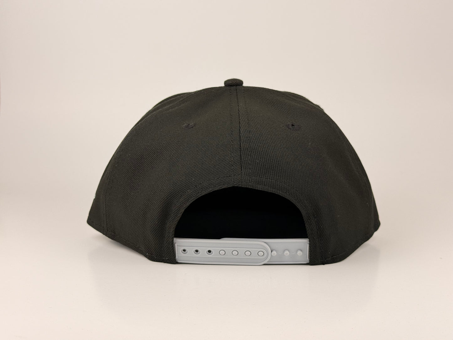 Las Vegas Raiders NFL New Era Cap 9FIFTY Snapback Hat Black Crown Gray Visor